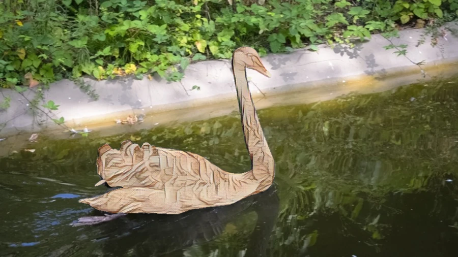 Stylized result: Reveal the original swan image and the selectively stylized AdaAttN result.