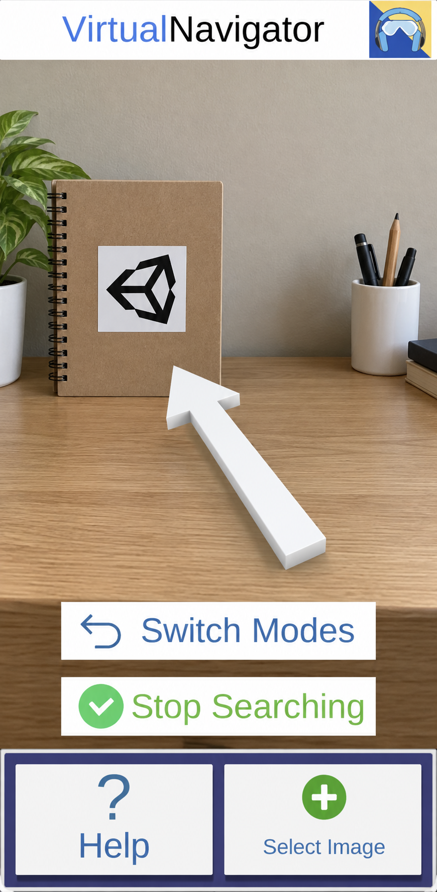 Illustration based on the portrait image-reference interface: a white arrow points up and left toward a registered square sticker on a notebook. Select Image, Stop Searching and Switch Modes controls remain visible.